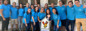 RMHC volunteers all wearing blue shirts in a group photo.